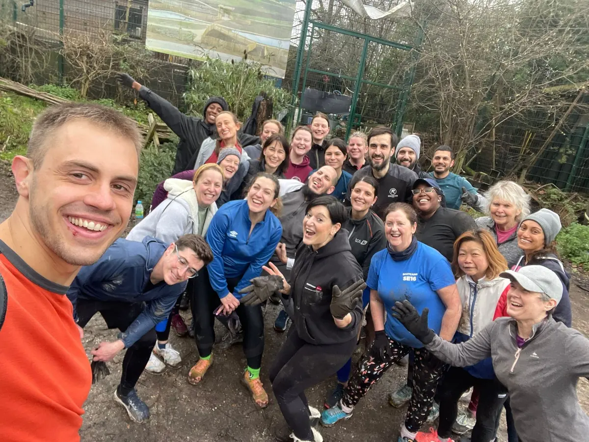 A big group of smiling Bootcamp SE16 members squeezed into a selfie after a session