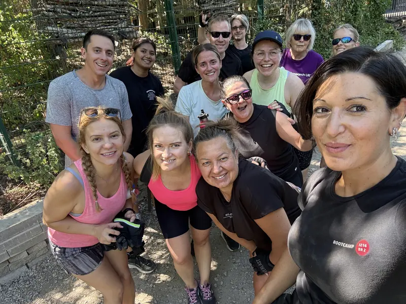Steph taking a selfie with a smiling group of Bootcamp SE16 members after a session